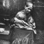 Woman living on street in London, 1876-77